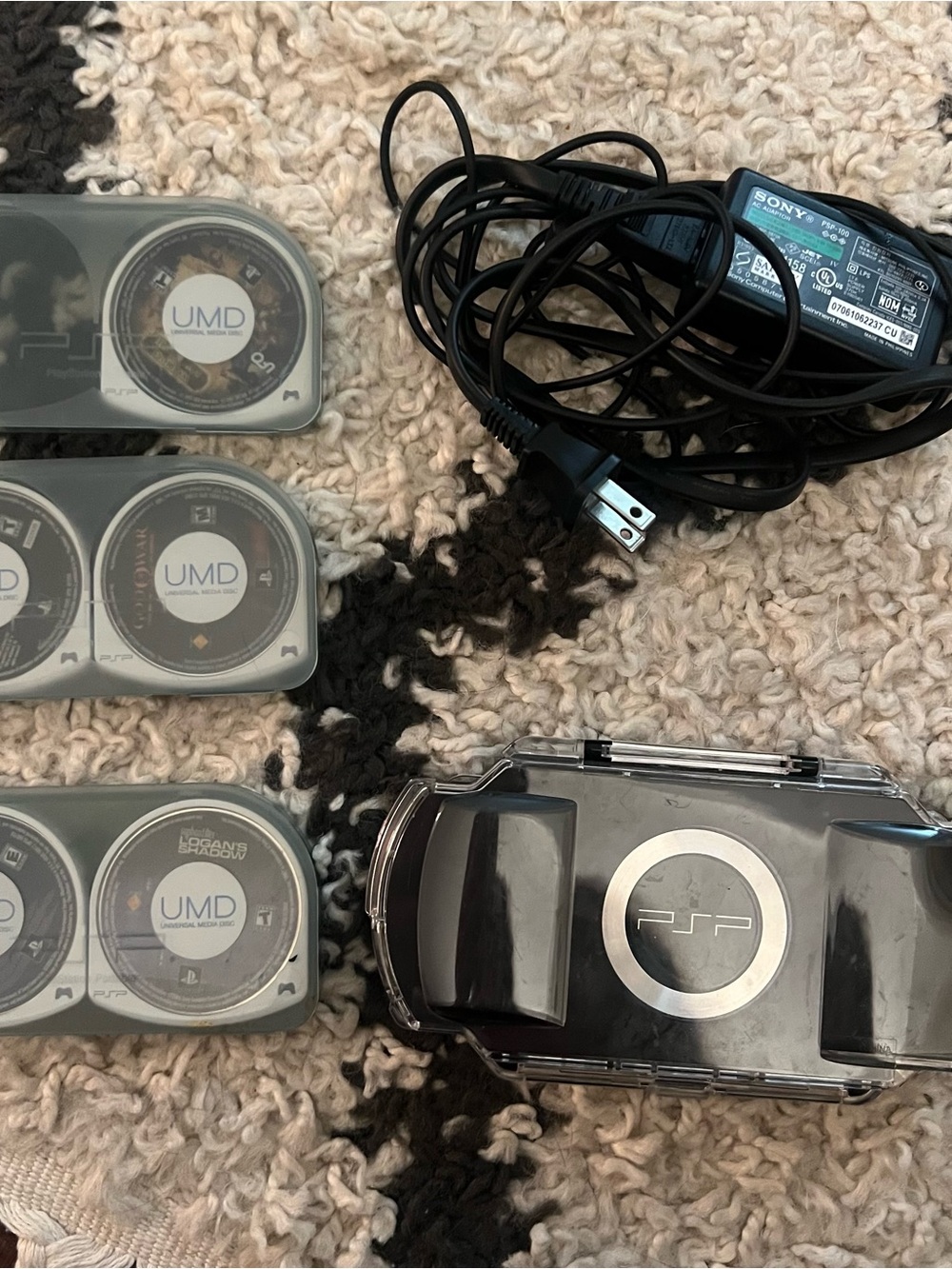 Sony PSP Handheld Gaming System in Black with Charger and UMD Cases